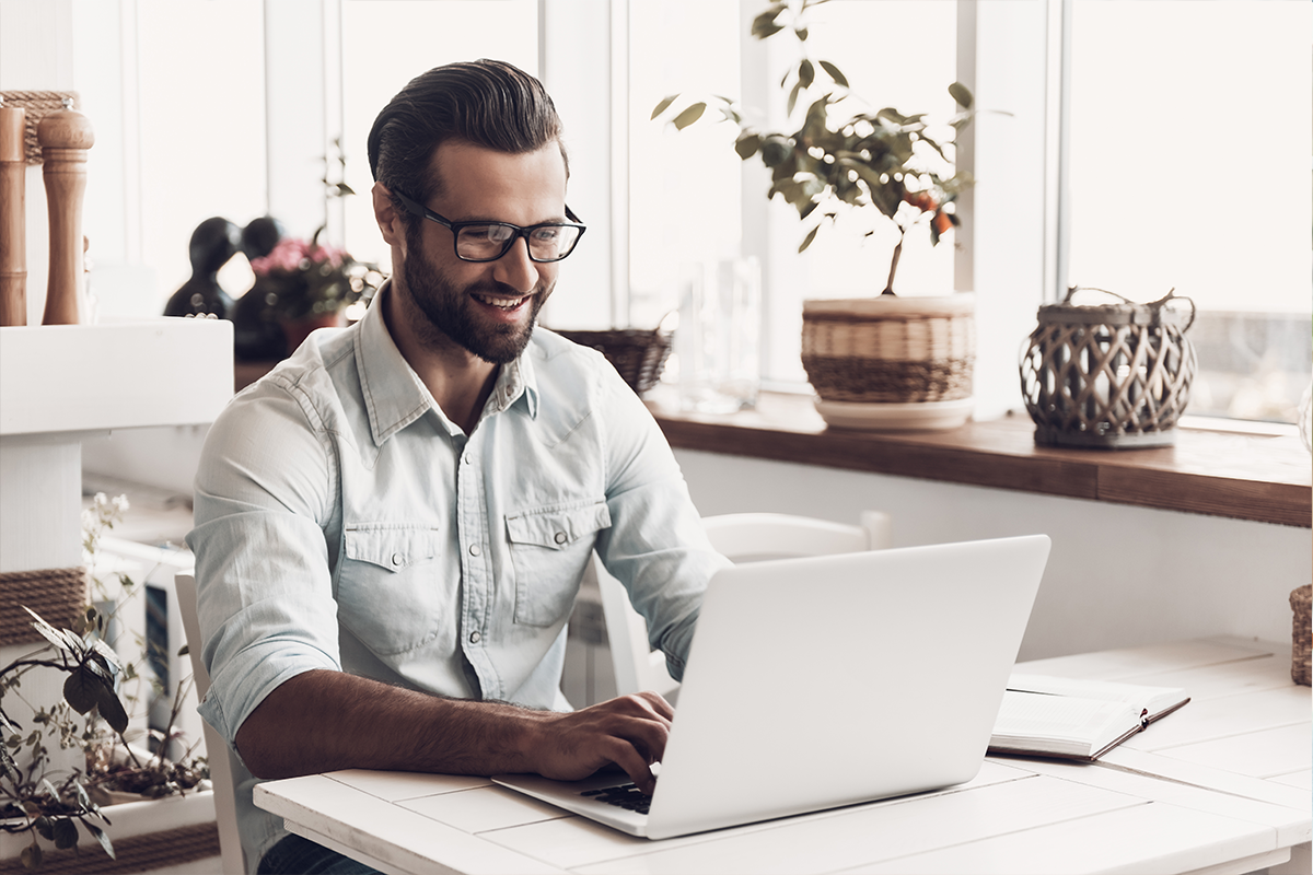 Young-Smiling-Man-Working-On.png