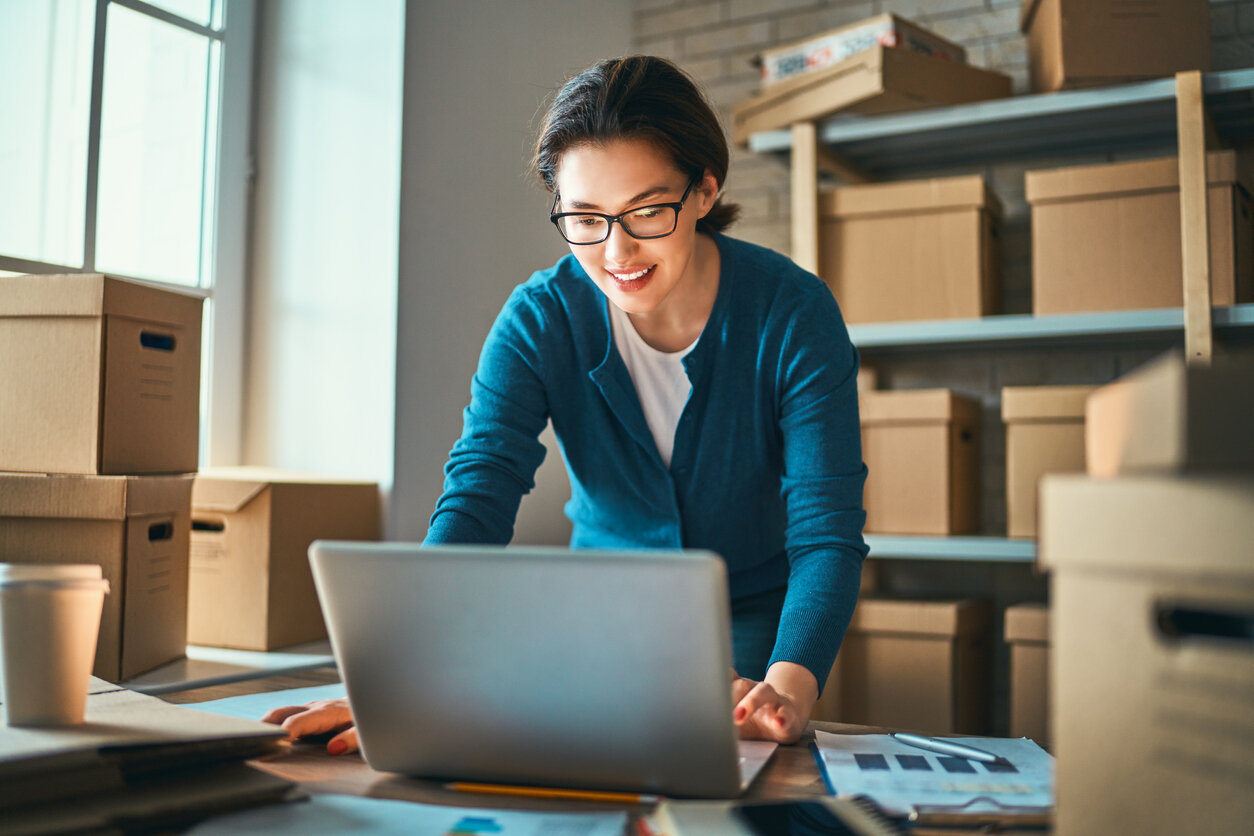 Woman woking using FBA Amazon Prep to send inventory to a fulfillment center