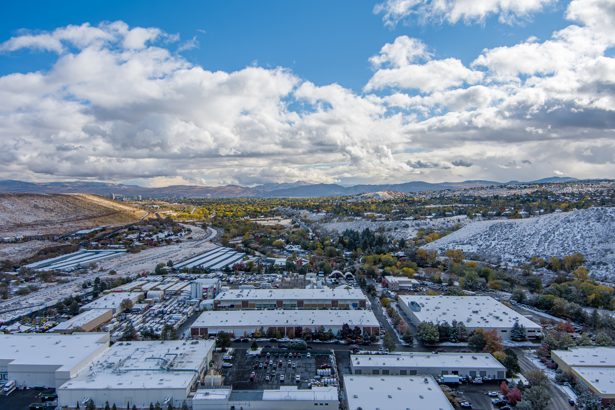 Aerial view of industrial area west of Reno, Nevada, an upcoming distribution hub after a late Autumn snowfall.