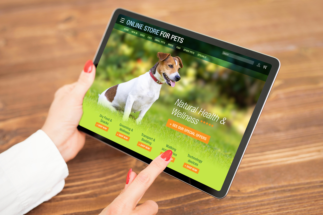 Woman shopping online for pets products and supplies