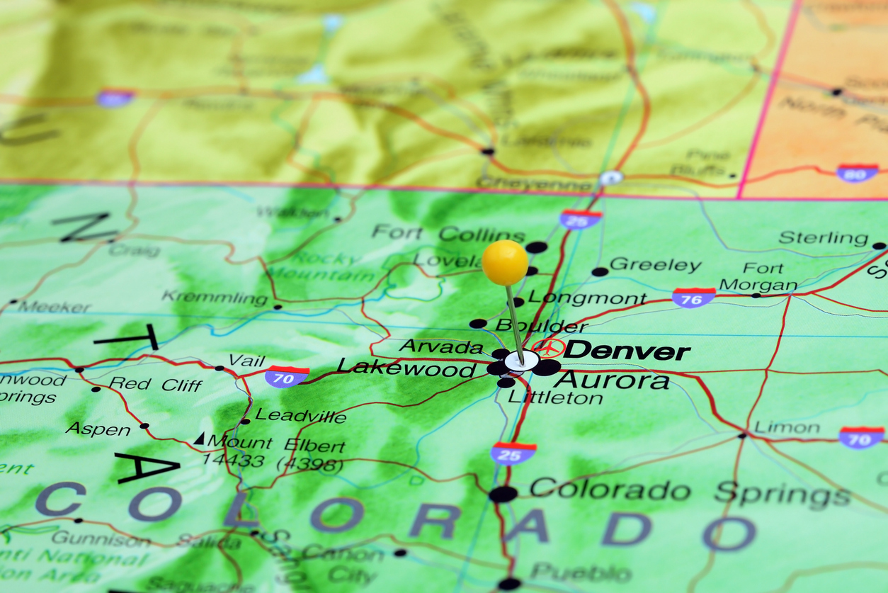 Photo of pinned Denver on a map of USA