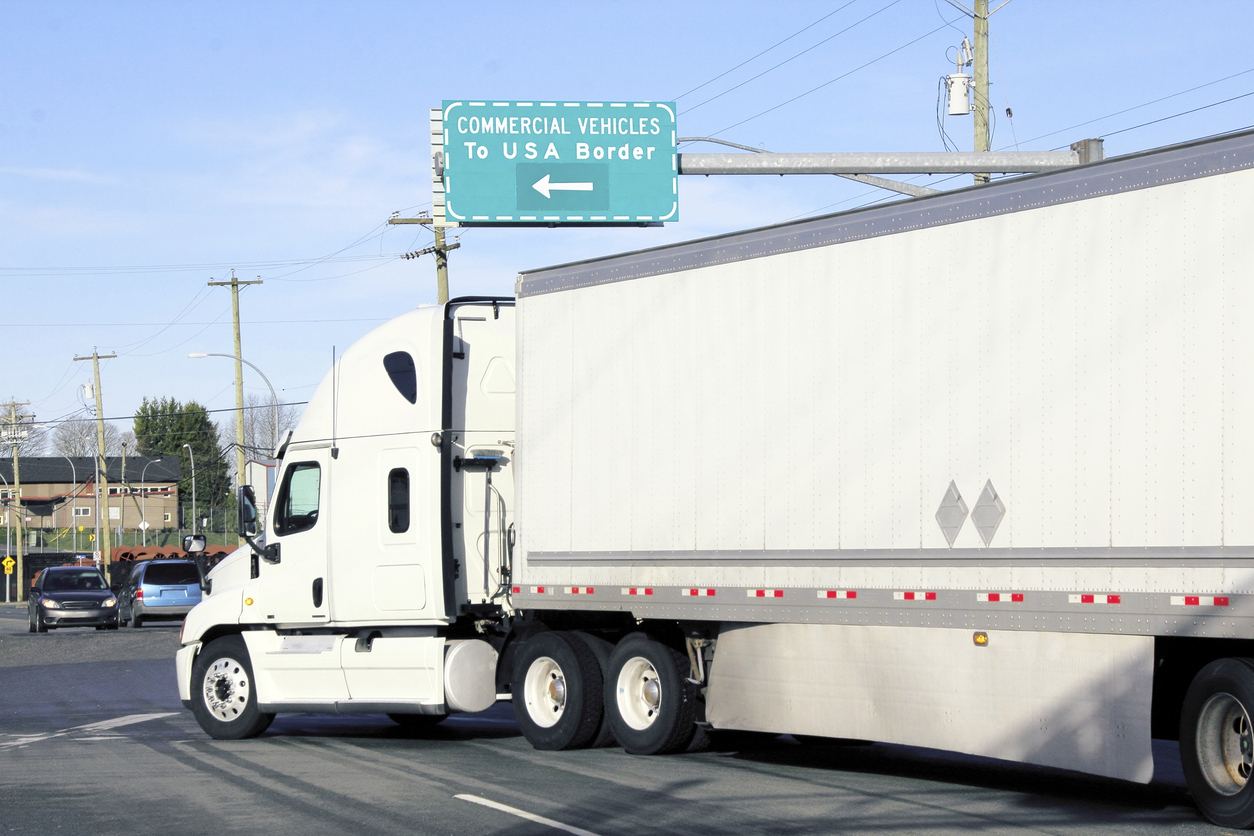 Large trucks use a commercial vehicle lane to import goods into the United States from Mexico under the IMMEX program