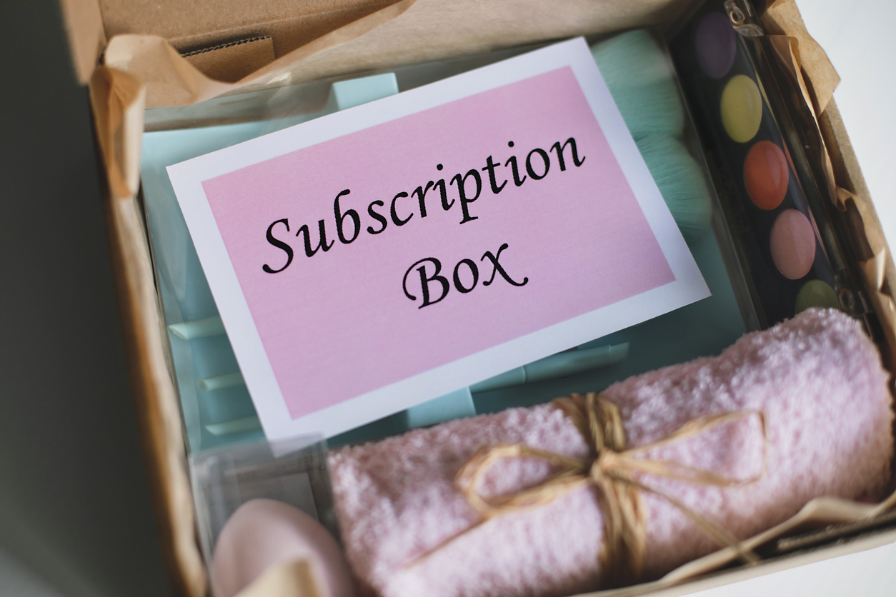Branded packaging and personalization designed at the subscription fulfillment stage. Box filled with beauty cosmetics products.
