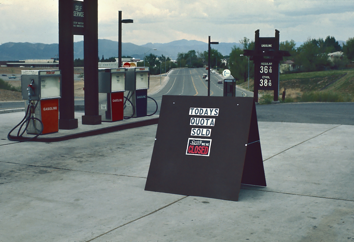 An image of a gas station in the 70's closed because the quota for the day had been reached. Apparently the quota issue has been solved by high gas prices. Vintage gas station sign reading 'When gasoline was affordable' during the 1970s oil crisis, highlighting fuel shortages and their impact on supply chains.