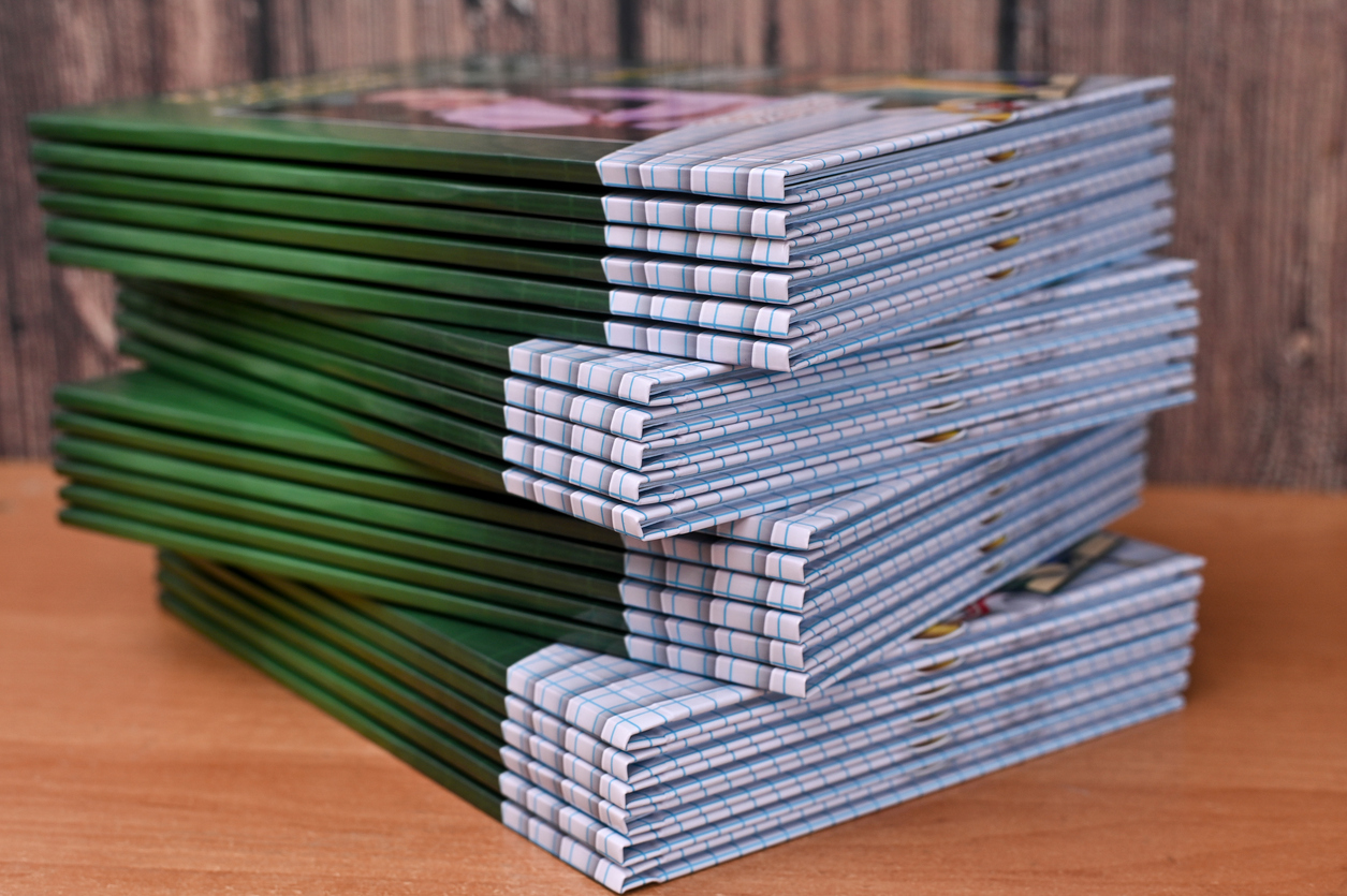 Stack of books representing bound printed matter typically shipped by publishers and media brands