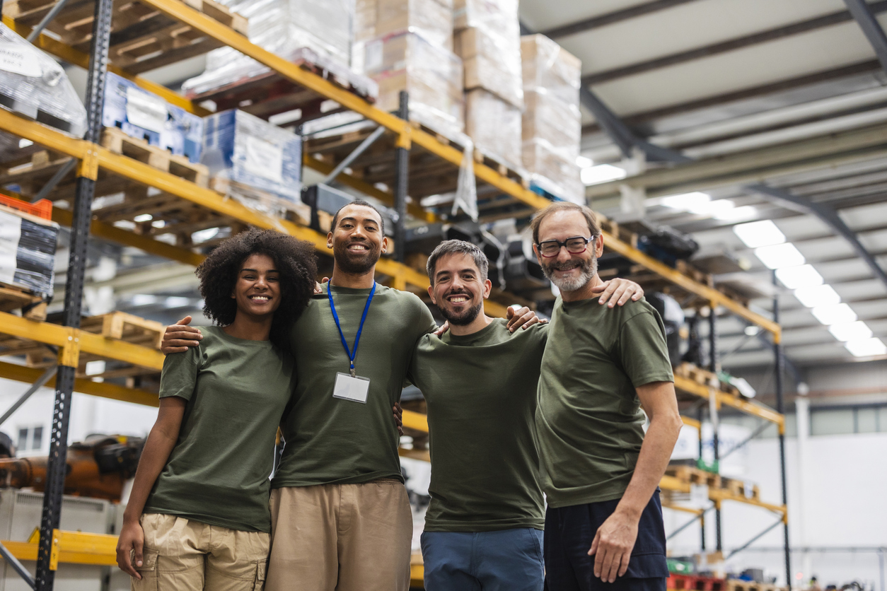Smiling warehouse team posing in a 3PL warehouse logistics partner